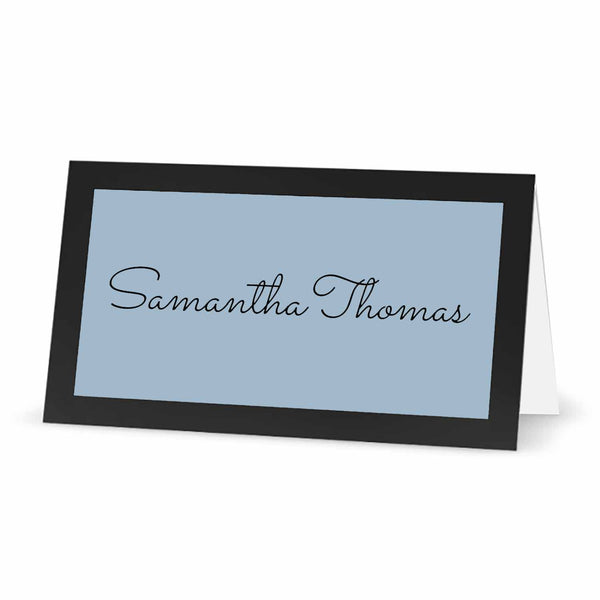 Black place card with pastel blue label.